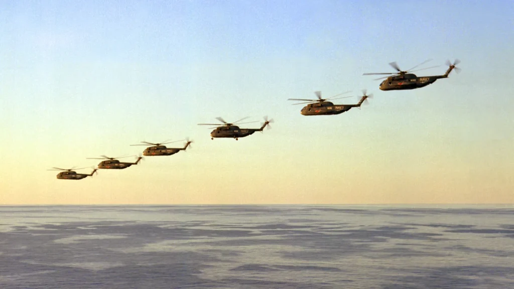 Six RH-53D Sea Stallion helicopters in flight, Apr 1980